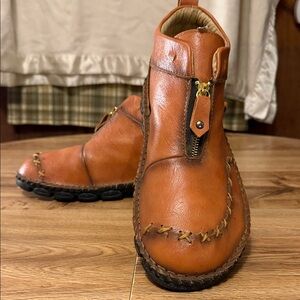 Brown zip boots stitch accents